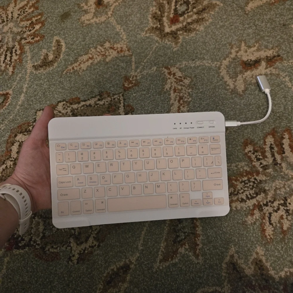 Bluetooth Keuboard For Cell Phones Or Tablets Comes With USB Cord Pink And White
